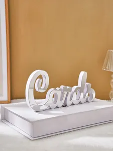 Close-up of white PVC mirror finish Cards letter sign for home wedding decor.