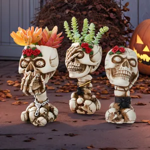 Vintage skull flower pots with red rose and spider details for gothic Halloween home decor