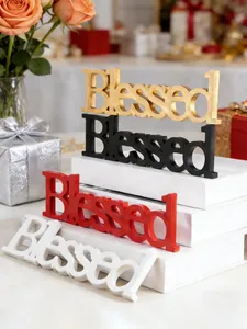 Close-up detail of Blessed letter decorative signs in gold, black, red, and white