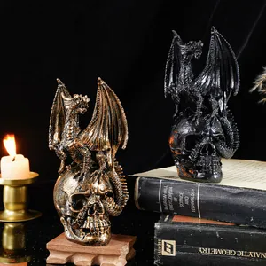 Detailed gothic dragon skull figurines in vintage bronze and black on old science books.