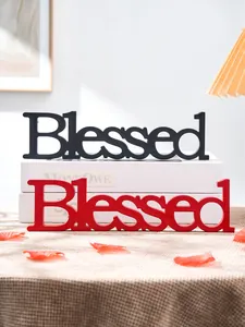 Red and black wooden Blessed letter signs on decorative books for home table decor