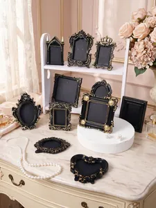 Selection of vintage black and gold relief photo frames in various ornate French styles
