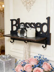 Elegante mensola a muro Blessed in legno nero decorata con rose e flacone di profumo