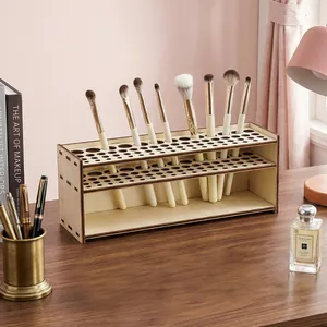 Minimalist wooden makeup brush organizer box shown on a desk with vanity props