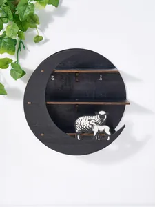 Modern black moon-shaped circular wooden shelf with sheep figurines wall decor