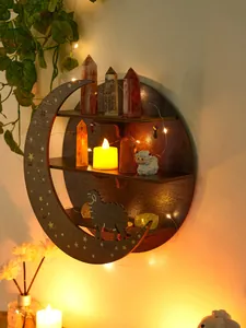 Detail view of a moon-shaped wooden wall shelf featuring crystal and candle decor
