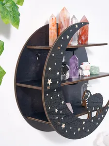 Close-up of crescent moon wall shelf with carved stars and decorative wooden sheep