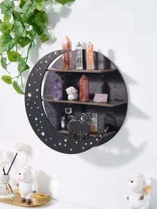 Detail view of a wooden crescent moon wall shelf display with crystal points and sheep decor