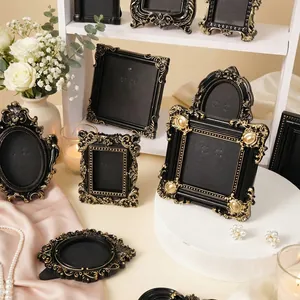 Elegant set of vintage black and gold embossed French style desktop picture frames