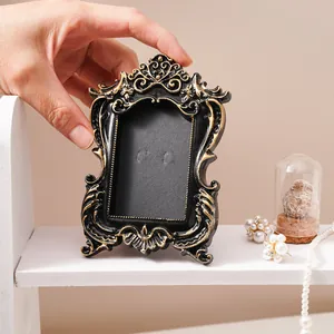 Vintage black gold embossed photo frame ornament with ornate French style carvings