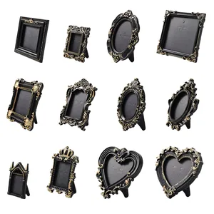 Vintage black and gold embossed photo frames in various French baroque styles for tabletop