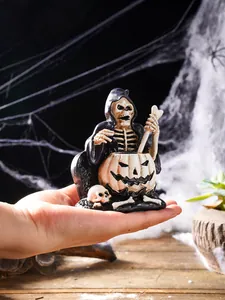 Handheld Halloween skeleton grim reaper resin figurine showing intricate design details
