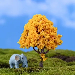 Detailed macro view of a miniature yellow flowering tree for DIY landscape sand table decor