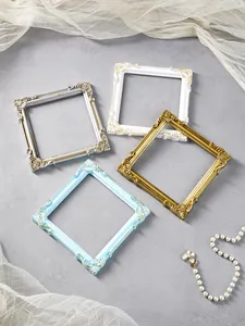 Detailed macro view of European style relief square frames used for vintage jewelry display