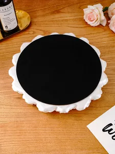Detail view showing the black non-slip bottom of the white rose carved resin decorative tray