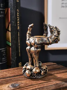 Gothic vintage hars skelet hand kandelaar met schedel basis decoratie detail