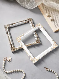 Close-up of vintage European embossed square frames used for jewelry photography props