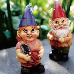 Detailed view of miniature garden gnomes holding shears and tools for outdoor decor