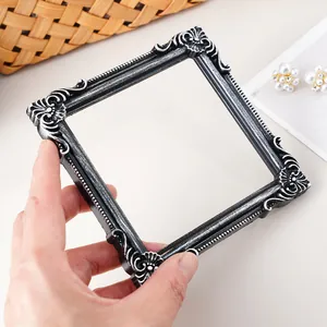 Close-up detail of vintage European style embossed square frame for jewelry display
