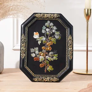 Detailed view of a vintage octagonal resin frame with golden floral embossing for home decor