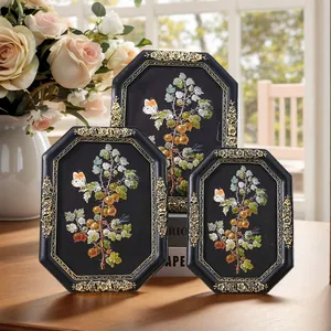 Set of 3 vintage European octagonal resin frames with gold floral embossing for decor.