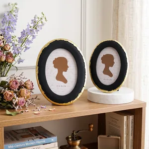 Cornici ovali vintage nere e oro con bordi dorati per decorazioni domestiche