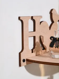 Close-up of wooden HOME letter wall shelf with natural wood grain detail