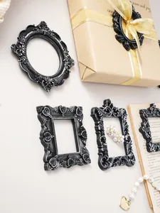 Detailed view of European retro resin carved frames with antique black silver finish