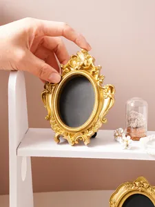 Detailed view of an ornate gold vintage picture frame with exquisite floral carvings