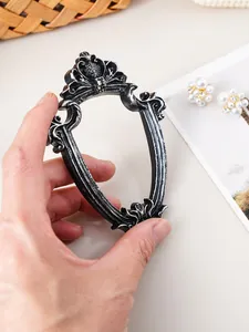 Detail of vintage European style resin mini picture frame with black silver finish