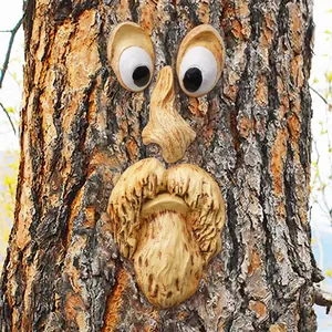 Detailed view of resin tree face outdoor garden decoration old man features