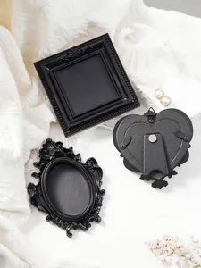 Detailed view of retro black mini magnetic picture frames in various shapes