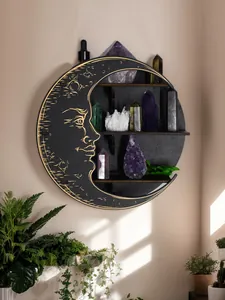 Aesthetic black crescent moon wall shelf with crystals in a sunlit interior room