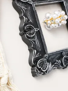 Detail view of European vintage resin photo frame with embossed carving and silver finish