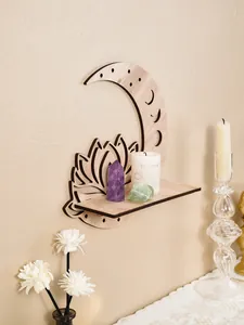 Bohemian style wooden lotus moon wall shelf displaying healing crystals and a white candle