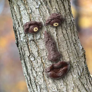 Detailed macro view of a resin tree face decoration mounted on a textured bark trunk