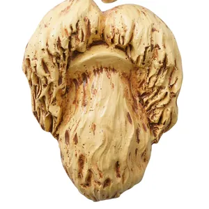 Detailed macro view of the weathered resin texture on a funny garden tree face ornament