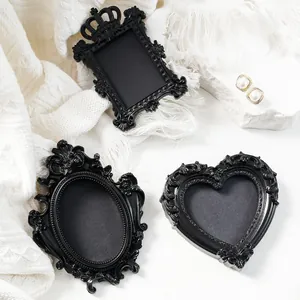 Vintage black mini magnetic picture frame props for creative photography and DIY decor.