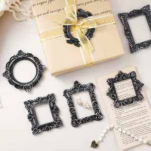 Vintage European style resin photo frames with ornate floral embossing in black and silver