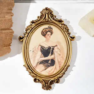 Ornate vintage French gold oval picture frame featuring a classic noble lady portrait
