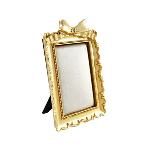 French vintage gilded bow jewelry display stand with elegant cream velvet lining for storage