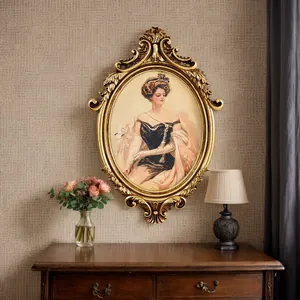 Vintage gold oval frame with European lady portrait hanging over a wooden dresser