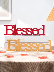 Detailed view of red and gold wooden Blessed letter signs for wedding and home decor