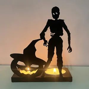 Halloween iron silhouette candle holder featuring a pumpkin and zombie figure decoration