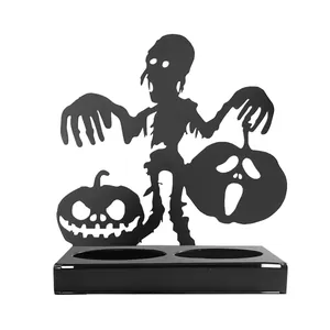 Halloween black metal silhouette candle holder featuring a zombie and jack-o-lantern design