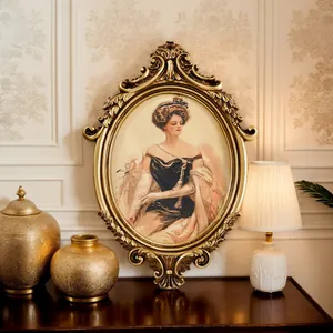 Exquisite close-up of French vintage gold carved oval frame with classic lady portrait