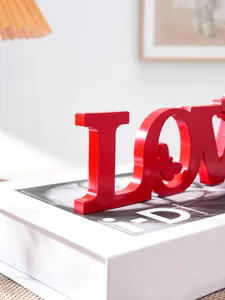 Red LOVE letter decoration close-up detail, perfect for romantic wedding party or home decor.