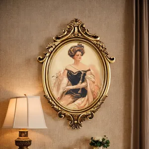 Ornate French vintage gold carved oval picture frame with a classic European lady portrait