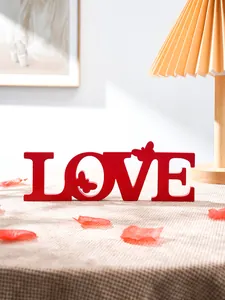 Red LOVE letter tabletop decoration with cute butterfly cutout for romantic wedding party decor.