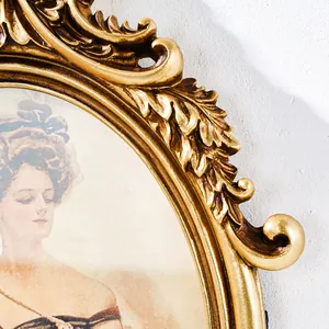 Detailed view of a French vintage gold carved oval frame with a noblewoman portrait.